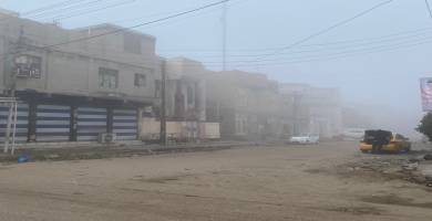بالصور: الضباب يحجب الرؤية في الناصرية